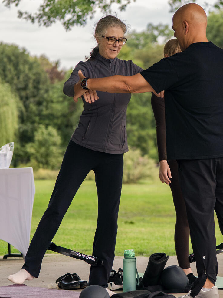 Balance Work Rafael helping participant find their center. Brookdale Park, Bloomfield, NJ.