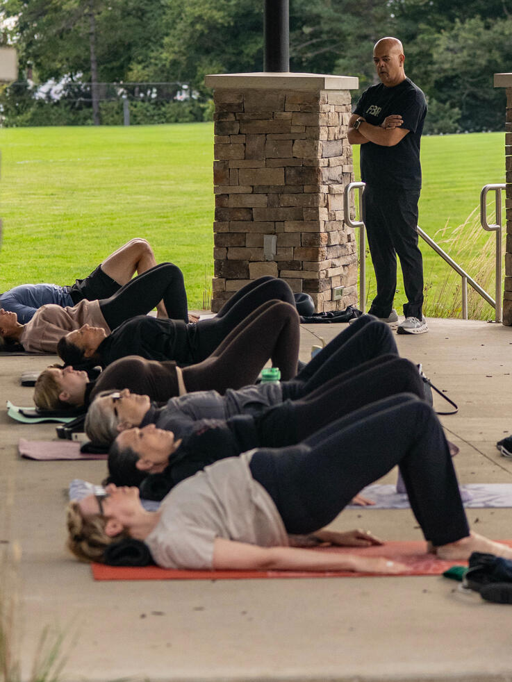 Bridging Mat class participants working on glutes, hamstrings and lumbo-pelvic mobility.
